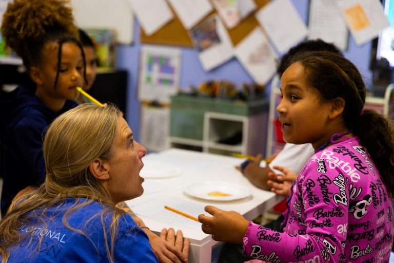 REALM co-founder Jessica Slayback talks with a student.