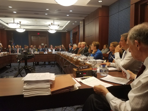 Politicians in a board room.