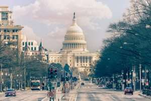 US Capitol building viewed from a road.