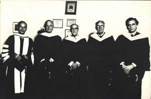 Black-and-white photo of Manuel Ayau, Henry Hazlitt, Leonard Read, and Alberto Benegas Lynch Jr. at the 1976 Honoris Causa