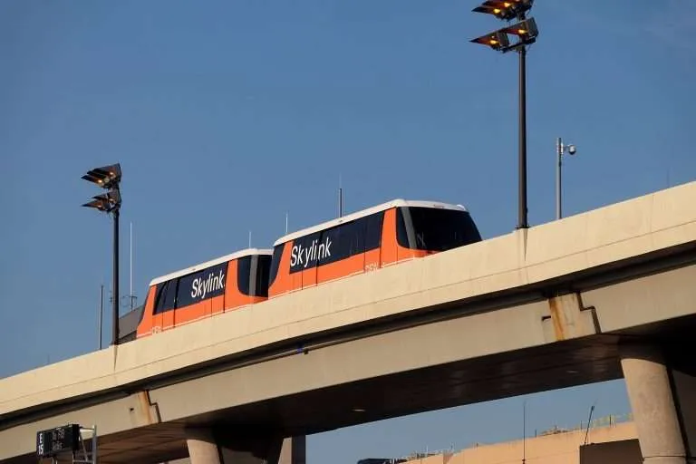 Skylink train on elevated tracks.
