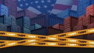 Shipping containers with caution tape in front of them saying "TARIFF"