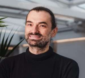 Olivier Usher, a white man with a beard