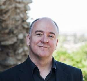 Kerry Brown is wearing a black shirt