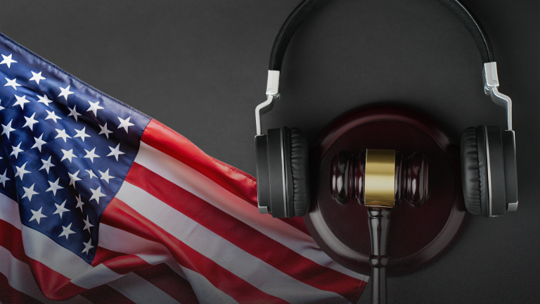 American flag with gavel and headphones.