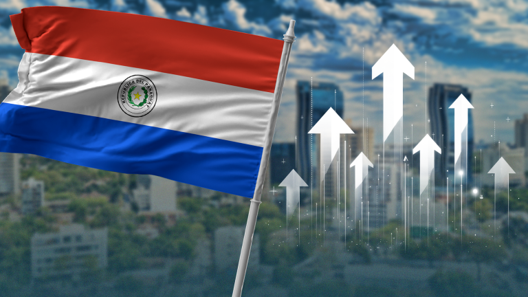 Paraguay flag with buildings in the background.