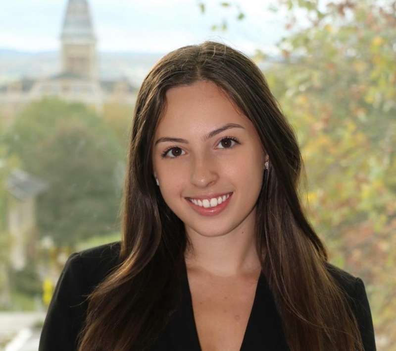 Alyssa Serebrenik is wearing a black jacket