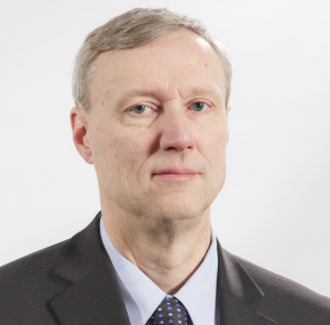 A white man in a suit and tie