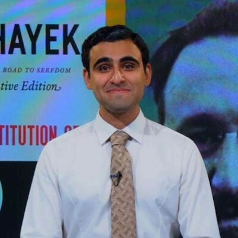 Photo of Mani Basharzad, in white shirt and tie