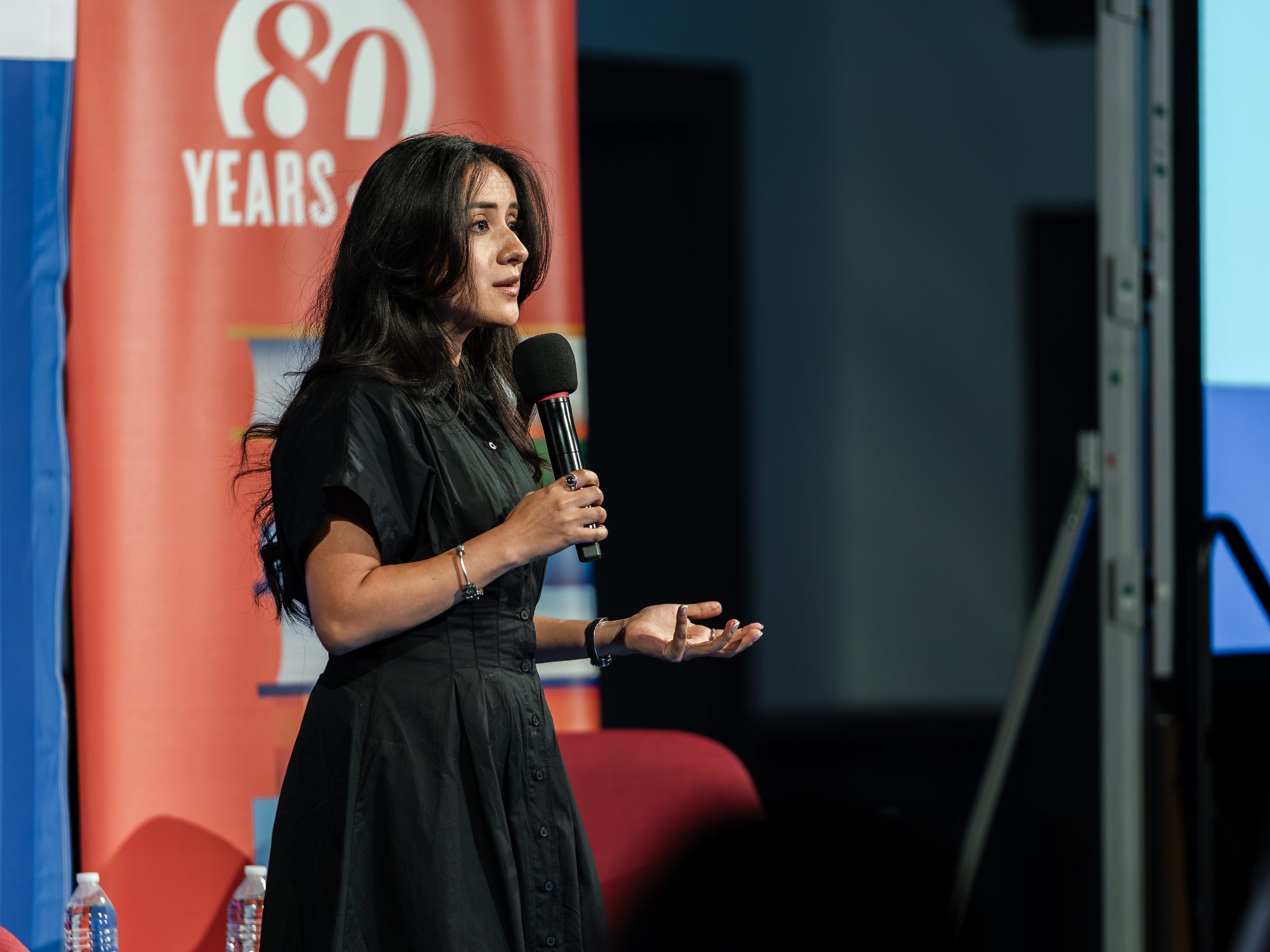 Photo of FEE staff giving speech at Summer Campus event.