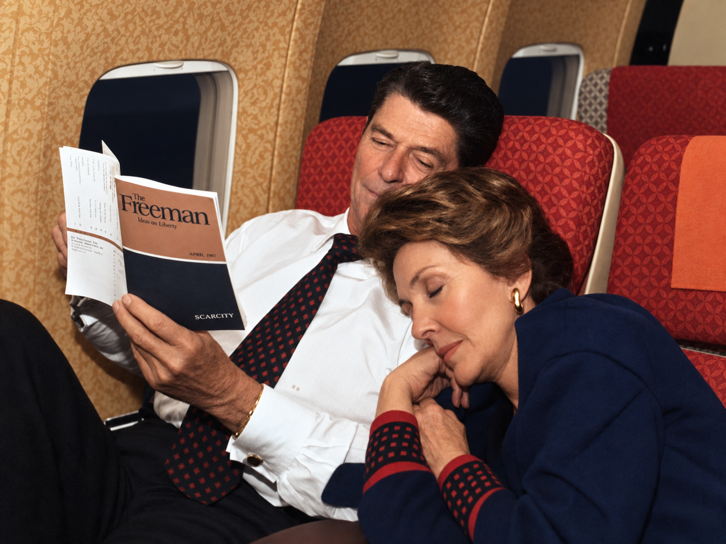 Enhanced photo of Ronald Reagan reading The Freeman.
