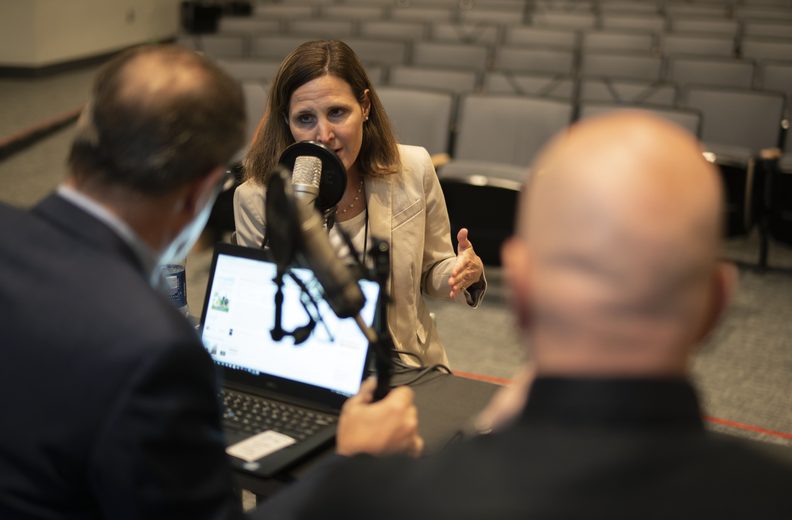 Attendees in conversation at a FEE conference