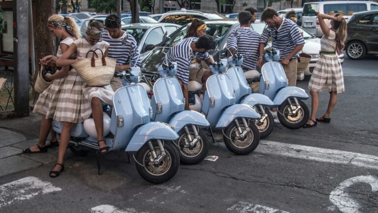 Young people with vespas in the street