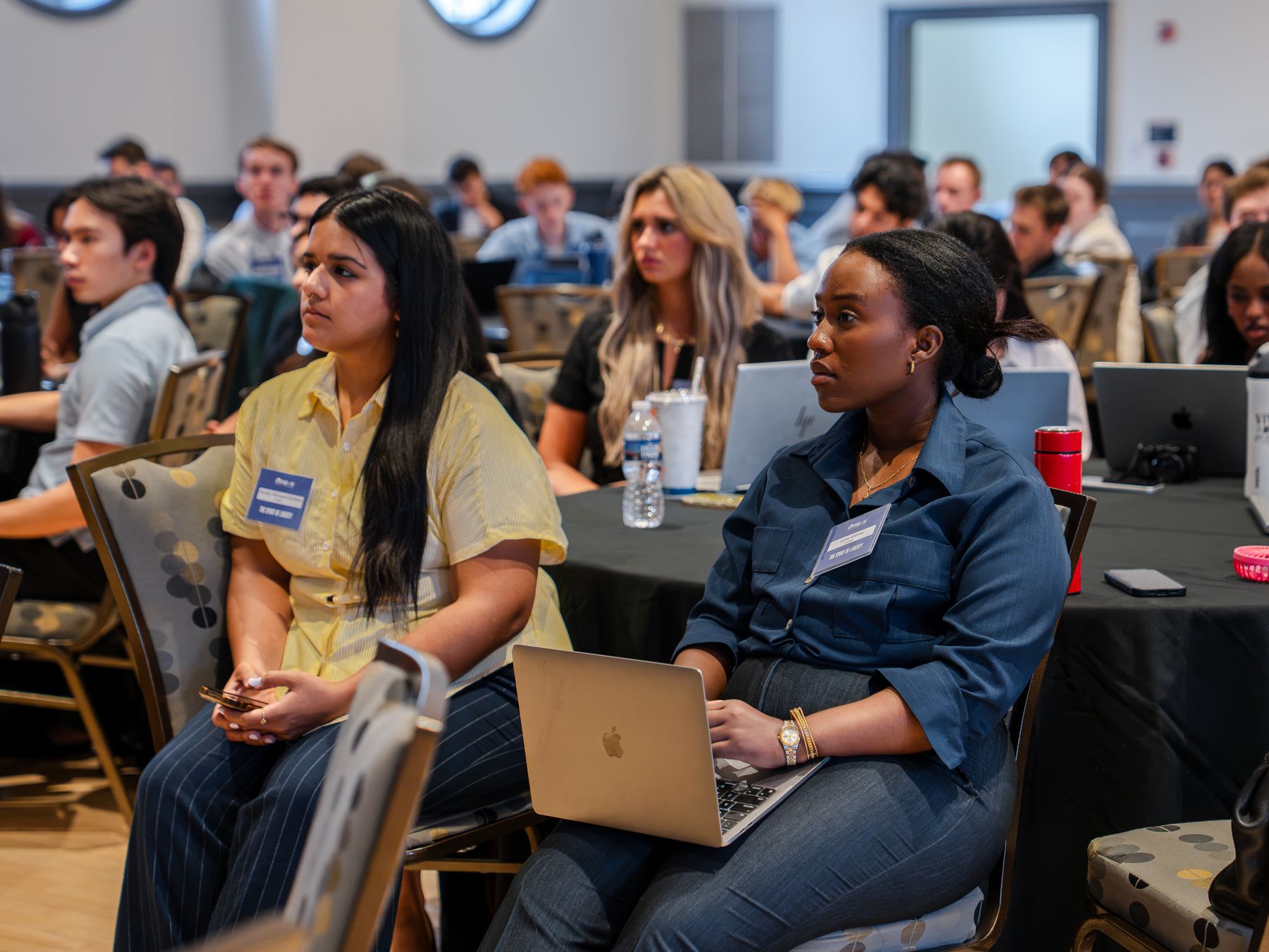 Students listening to a lecture at a FEE program