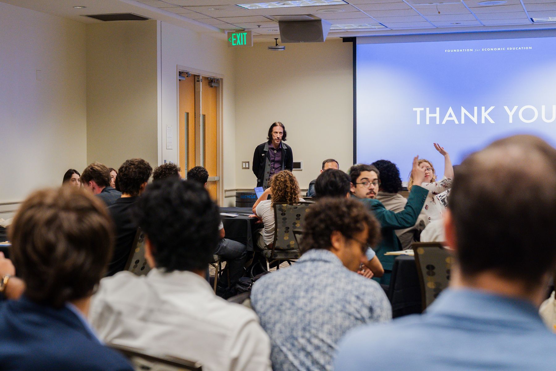 A FEE faculty member taking questions from a room of students