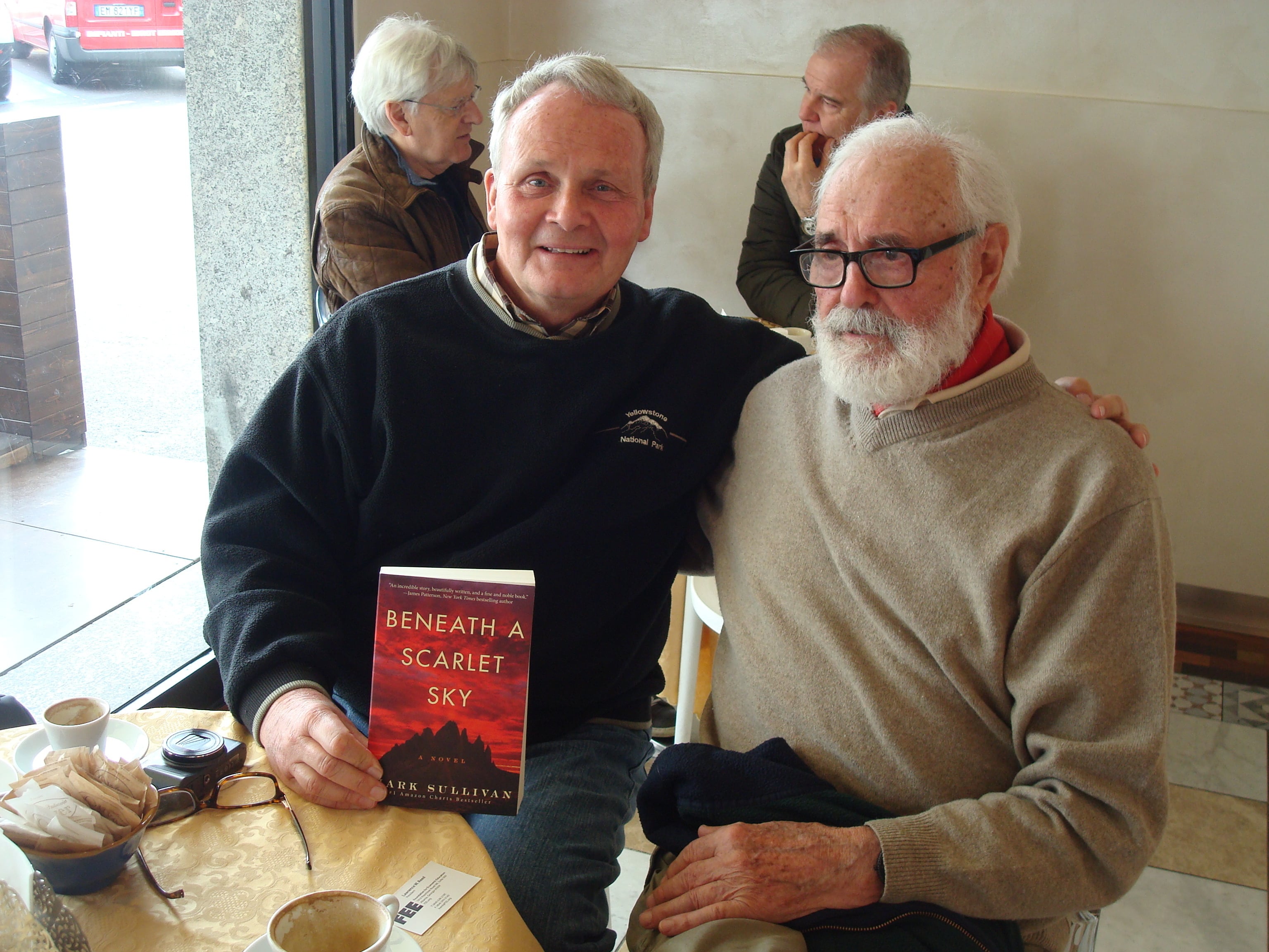 Lawrence Reed in a cafe with Pino Lella.